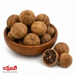 تصویری از چند عدد لیمو عمانی درشت و سالم با رنگ قهوه‌ای روشن در یک کاسه چوبی